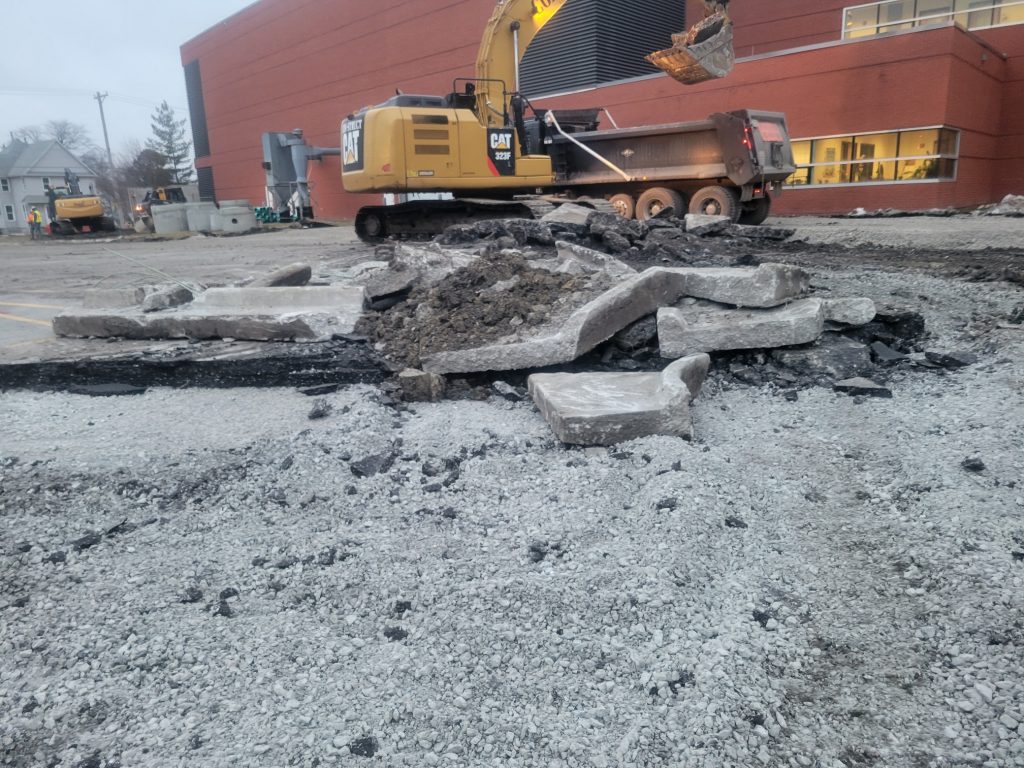 concrete demolition begins with heavy equipment