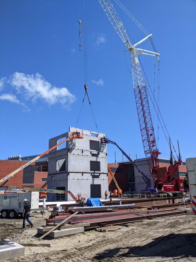 crane handling building components on Therkildsen Industrial Engineering building construction site