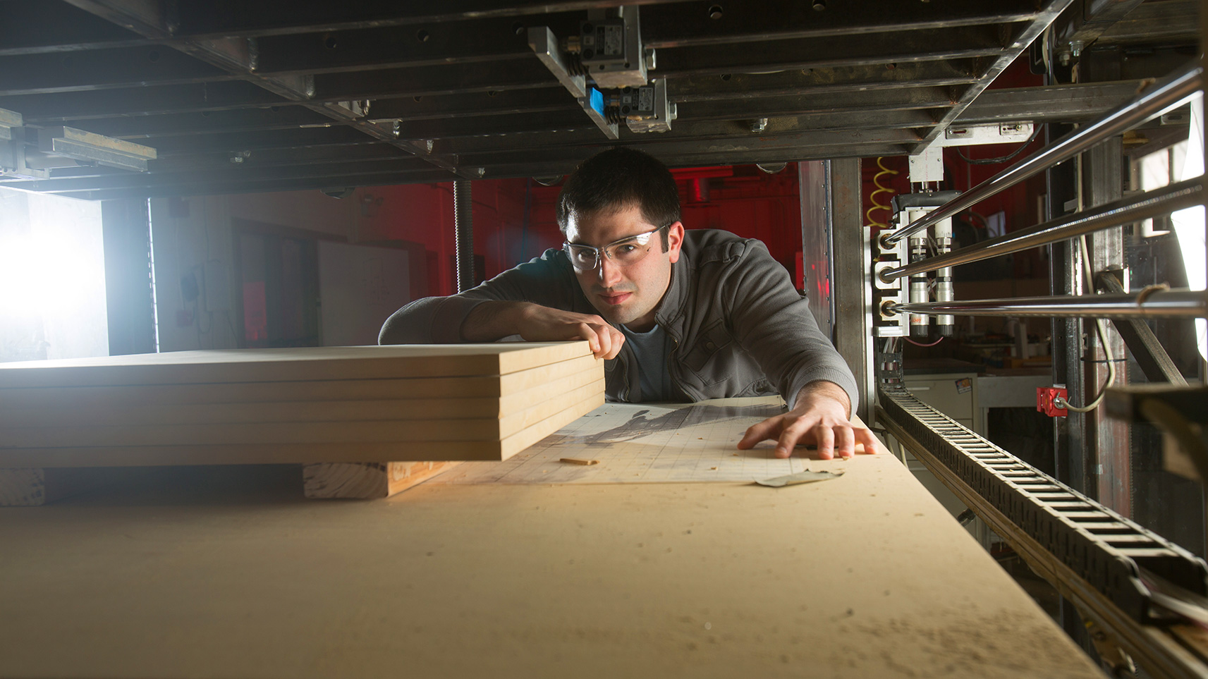 student working with material in rapid prototyping lab