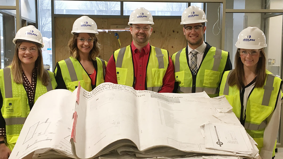 student group photo at construction site