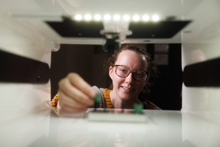 Student works with equipment in an engineering lab.